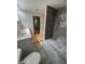 Modern bathroom with a double vanity, gray tile shower, and stylish fixtures creating a spa-like retreat at 1713 Cagle Ct, Lawrenceville, GA 30045