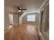 Spacious bedroom with wood floors, a ceiling fan, and a large window, offering ample natural light at 1713 Cagle Ct, Lawrenceville, GA 30045