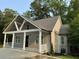 Inviting home with a modern design and a well-maintained lawn, nestled amongst mature trees at 1713 Cagle Ct, Lawrenceville, GA 30045