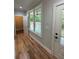 Hallway with views of the rear deck offers access to outdoor living spaces at 1713 Cagle Ct, Lawrenceville, GA 30045