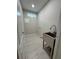 Functional laundry room with stainless steel sink and tile floors provides convenience at 1713 Cagle Ct, Lawrenceville, GA 30045