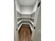 Organized pantry with white shelving and hardwood floors, offering ample storage space at 1713 Cagle Ct, Lawrenceville, GA 30045