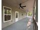 Inviting porch with ceiling fans, providing an ideal spot for relaxation and outdoor enjoyment at 1713 Cagle Ct, Lawrenceville, GA 30045