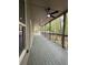 Spacious outdoor porch featuring ample seating and scenic views of the lush backyard and trees at 1713 Cagle Ct, Lawrenceville, GA 30045