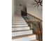 Elegant staircase with wrought iron railings, and wood treads leading to the upper level at 1713 Cagle Ct, Lawrenceville, GA 30045
