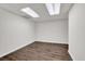 Finished basement with wood floors, white walls, drop ceiling and recessed lighting at 2010 Riverside Rd, Roswell, GA 30076