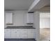 Finished basement with built-in cabinetry and countertops offers versatility and storage at 2010 Riverside Rd, Roswell, GA 30076