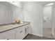 Bright bathroom with large mirror, single vanity and view into the adjacent shower at 2010 Riverside Rd, Roswell, GA 30076