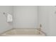 A bright, clean bathroom featuring a white bathtub with chrome fixtures at 2010 Riverside Rd, Roswell, GA 30076