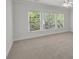 Neutral bedroom with large windows offering lots of natural light and neutral carpet at 2010 Riverside Rd, Roswell, GA 30076