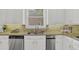 Detailed view of kitchen countertop with stainless steel sink, fixtures, and backsplash at 2010 Riverside Rd, Roswell, GA 30076