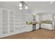 Open kitchen featuring white cabinetry, granite countertops, stainless steel appliances, and ample storage at 2010 Riverside Rd, Roswell, GA 30076
