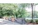 Serene park view with benches and potted plants along the river at 2010 Riverside Rd, Roswell, GA 30076