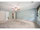 Large bedroom with neutral carpet, light blue walls, and plenty of natural light at 4772 Ridgewood Nw Ct, Acworth, GA 30102