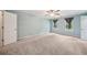 Spacious bedroom with neutral carpet, light blue walls, and windows with dark gray curtains at 4772 Ridgewood Nw Ct, Acworth, GA 30102