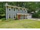 Traditional two-story home with a covered front porch, a well-maintained lawn, and a two-car garage at 4772 Ridgewood Nw Ct, Acworth, GA 30102