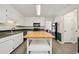 Well-lit kitchen with an island, ample cabinet space, and an open layout; ideal for cooking and entertaining at 4772 Ridgewood Nw Ct, Acworth, GA 30102