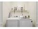 Convenient laundry area with modern appliances and ample storage space at 4772 Ridgewood Nw Ct, Acworth, GA 30102