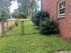 Side view of a backyard featuring a chain link fence surrounding a grassy area at 5607 Mountainbrooke Ct, Stone Mountain, GA 30087
