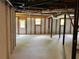 Unfinished basement featuring a concrete floor, white brick walls, and windows at 5607 Mountainbrooke Ct, Stone Mountain, GA 30087