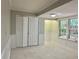 Versatile room with tile flooring, bi-fold closet doors, and abundant natural light at 5607 Mountainbrooke Ct, Stone Mountain, GA 30087