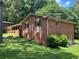 Brick home featuring well maintained landscaping with black shuttered windows offering classic charm at 5607 Mountainbrooke Ct, Stone Mountain, GA 30087