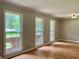 Bright living room boasting large windows, hardwood floors, and neutral wall colors at 5607 Mountainbrooke Ct, Stone Mountain, GA 30087