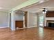 Open concept living area with fireplace, hardwood floors, and stylish architectural details at 5607 Mountainbrooke Ct, Stone Mountain, GA 30087