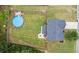 Aerial shot showing a home with large fenced backyard and a pool with wooden sundeck at 572 Boulder View Pkwy, Dallas, GA 30157