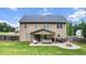 Large backyard featuring a patio with outdoor seating and a fire pit at 572 Boulder View Pkwy, Dallas, GA 30157