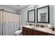 Bathroom featuring a double vanity with granite countertops and a shower with a curtain at 572 Boulder View Pkwy, Dallas, GA 30157