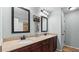 Bathroom featuring dual sinks with granite countertops and ample storage at 572 Boulder View Pkwy, Dallas, GA 30157