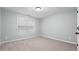 Cozy bedroom with neutral color scheme and carpeted floors at 572 Boulder View Pkwy, Dallas, GA 30157