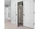 Spacious closet with double doors and ample storage space in neutral color scheme at 572 Boulder View Pkwy, Dallas, GA 30157