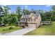 Inviting two-story home with well-maintained lawn, stone accents, and a refreshing above-ground pool at 572 Boulder View Pkwy, Dallas, GA 30157