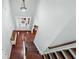Bright two-story foyer featuring hardwood floors, stairs, and a front door with sidelights at 572 Boulder View Pkwy, Dallas, GA 30157