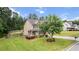 Well-manicured lawn and landscaping accentuates this traditional two-story home with a charming front porch at 572 Boulder View Pkwy, Dallas, GA 30157