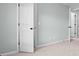 Hallway with carpet and white doors provides access to the rooms at 572 Boulder View Pkwy, Dallas, GA 30157