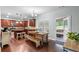 Bright kitchen with stainless steel appliances, granite counters, and a cozy breakfast nook area at 572 Boulder View Pkwy, Dallas, GA 30157
