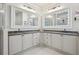 This bathroom has dual vanities, each with large mirrors and great lighting at 2112 Murren Se Dr, Smyrna, GA 30080