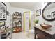 Bright bathroom features a glass bowl sink atop mosaic tile, as well as a glass door shower and display shelving at 2112 Murren Se Dr, Smyrna, GA 30080