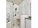 Close up on the glass shower with black hardware and a built-in seat at 2112 Murren Se Dr, Smyrna, GA 30080