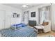 Charming bedroom with a playhouse bed, cozy armchair, and a custom rug at 2112 Murren Se Dr, Smyrna, GA 30080
