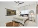 Cozy bedroom boasts neutral decor, a ceiling fan, and a large window that lets in plenty of natural light at 2112 Murren Se Dr, Smyrna, GA 30080