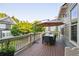 Outdoor deck features a table with seating and umbrella, offering a great space for entertaining and relaxation at 2112 Murren Se Dr, Smyrna, GA 30080