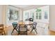 Bright dining room features hardwood floors, large picture windows, room for table with seating for six, and natural light at 2112 Murren Se Dr, Smyrna, GA 30080