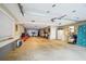 Spacious garage interior with ample room for parking and storage, including garage doors, and a kitchen in the back at 2112 Murren Se Dr, Smyrna, GA 30080