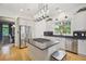 Bright kitchen with stainless steel appliances, island cooktop, and white cabinetry at 2112 Murren Se Dr, Smyrna, GA 30080