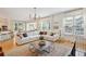Spacious living room features hardwood floors, comfortable seating, a fireplace, and open concept floorplan with lots of light at 2112 Murren Se Dr, Smyrna, GA 30080