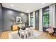 Stylish home office with dark walls, white curtains, and ample natural light at 2112 Murren Se Dr, Smyrna, GA 30080